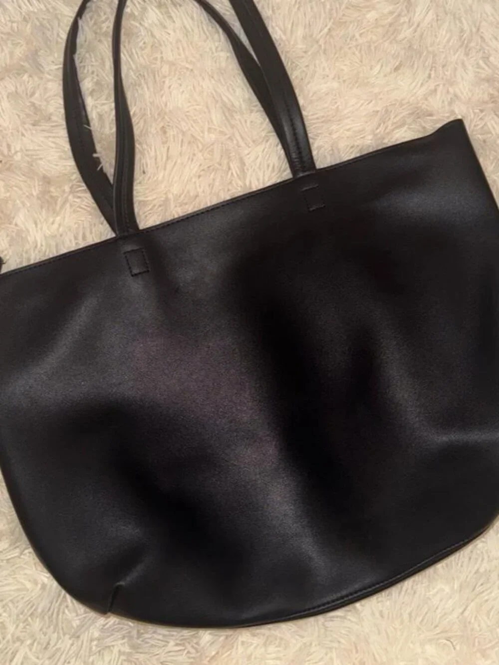 Unsure black leather